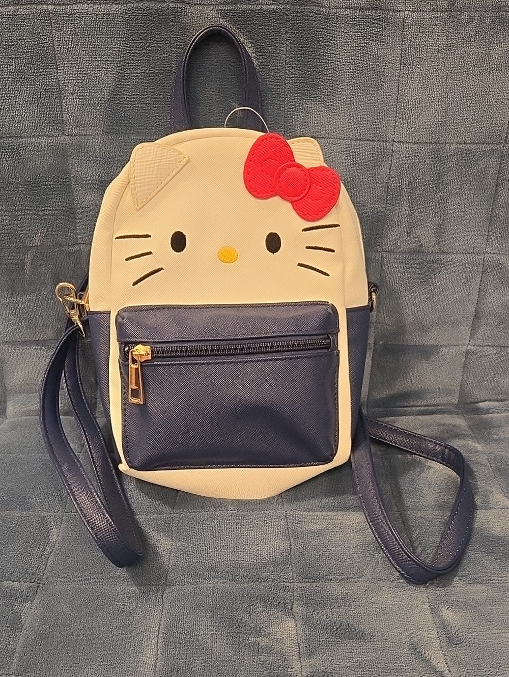 White and Navy Cute Character Mini Backpack with Red Bow Accent